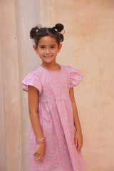 Girls pink floral dress made from 100% organic cotton with flutter sleeves